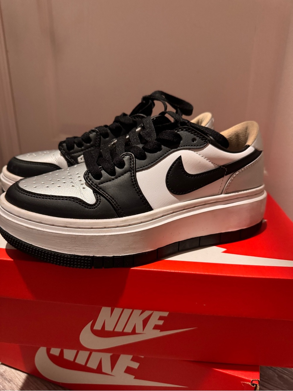 Woman Low-Top Platform Sneakers in Black, White, and Silver